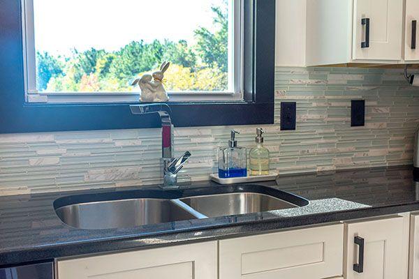 Absolute Black Granite With Glass Tile Backsplash And Sink